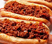 The best hot dog chili on top of hot dogs.
