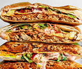 Four halves of two crunchwraps in a stack.