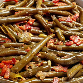 An overhead image of a large bowl of Crockpot green beans.